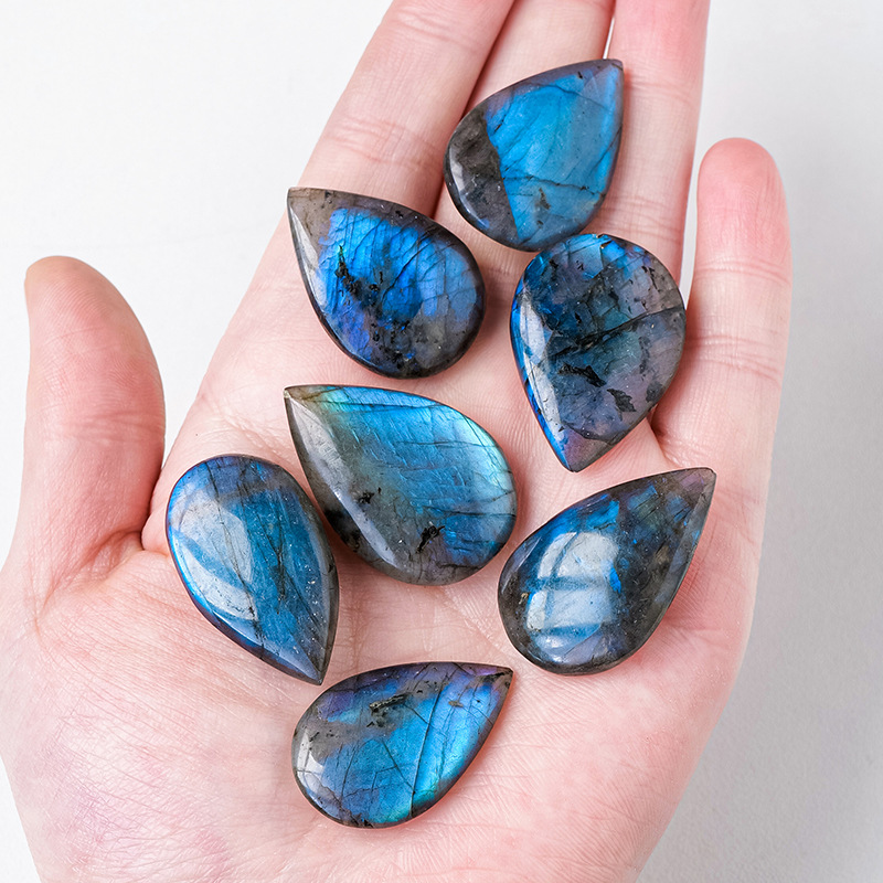 Natural Crystal Blue Light Elongates Stone Droplets
