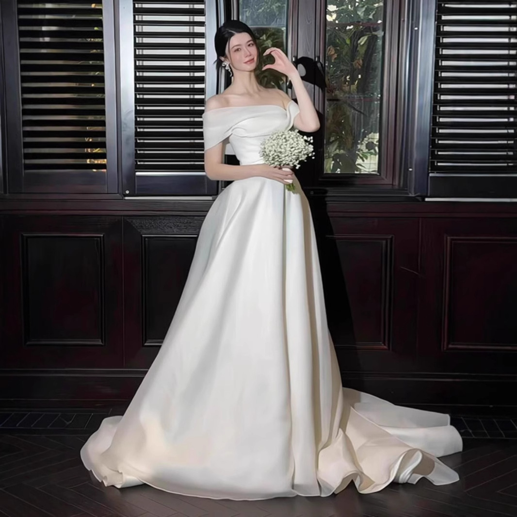 Elegant Satin Off-shoulder Light Wedding Dress Simple And Sophisticated photo 1