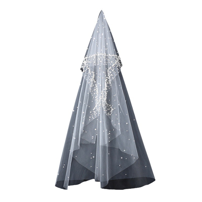 The Bridal Gown Features Round Pearl Embellishments Exuding A Vintage High-end Elegance photo 5