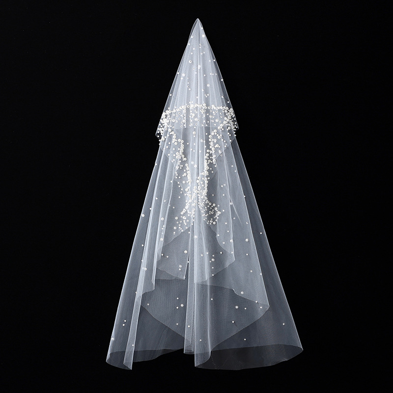 The Bridal Gown Features Round Pearl Embellishments Exuding A Vintage High-end Elegance photo 1