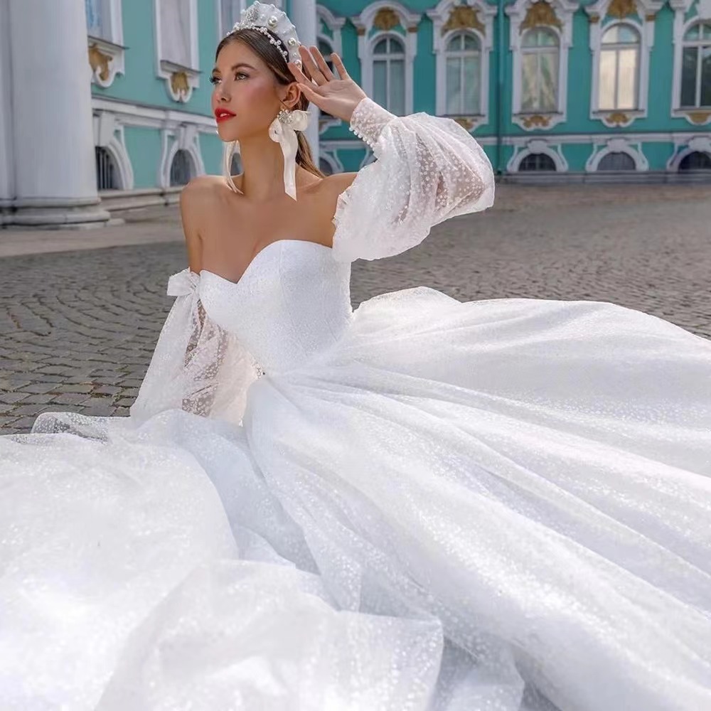 Off-shoulder Lightweight Wedding Dress That Flatters The  With A Trailing Train photo 5