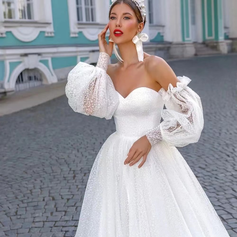 Off-shoulder Lightweight Wedding Dress That Flatters The  With A Trailing Train photo 2