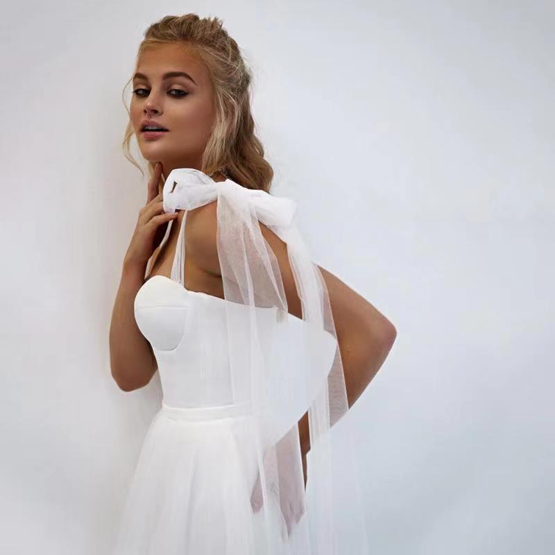 French-style Strapless Wedding Dress With A Bow Featuring A Tulle Train photo 6
